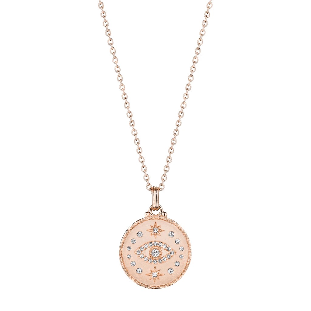 Locket style medallion pendant with evil eye in the center and diamonds on the outside, crafted in rose gold and diamonds