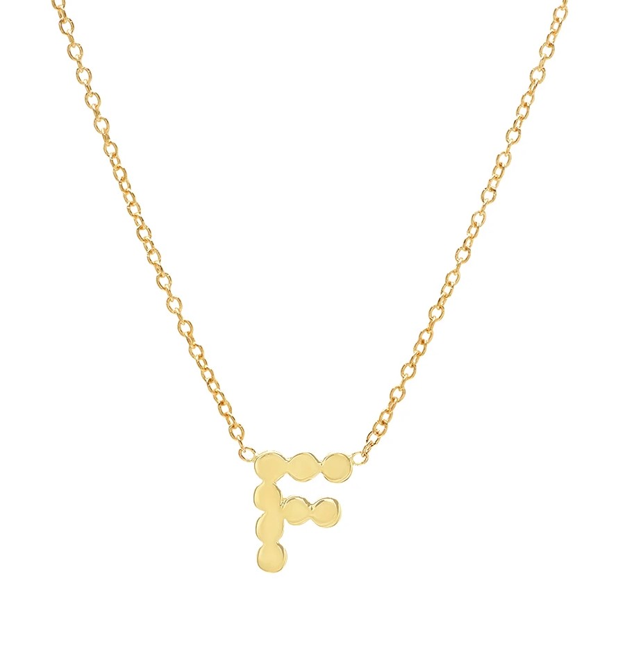 Letter F necklace in yellow gold with scalloped edges.