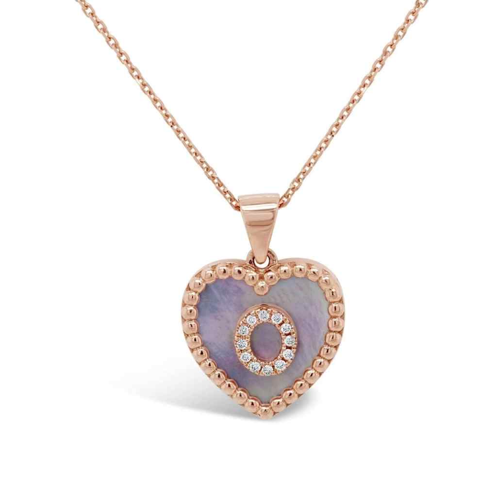 Heart pendant with mother of pearl base and letter O studded with diamonds in the center.