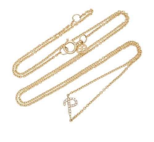 Gold and diamond studded letter P necklace.
